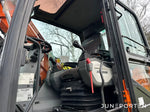 Hjulgrävare Doosan DX140W med dumpervagn