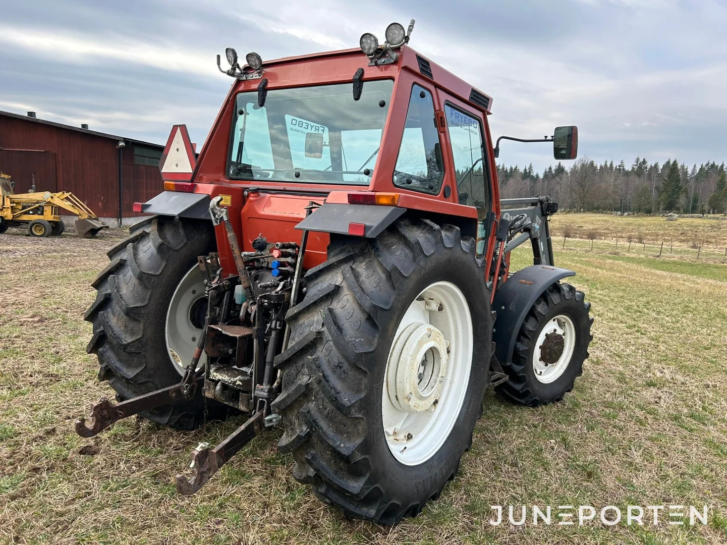 New Holland 110-90 med lastare