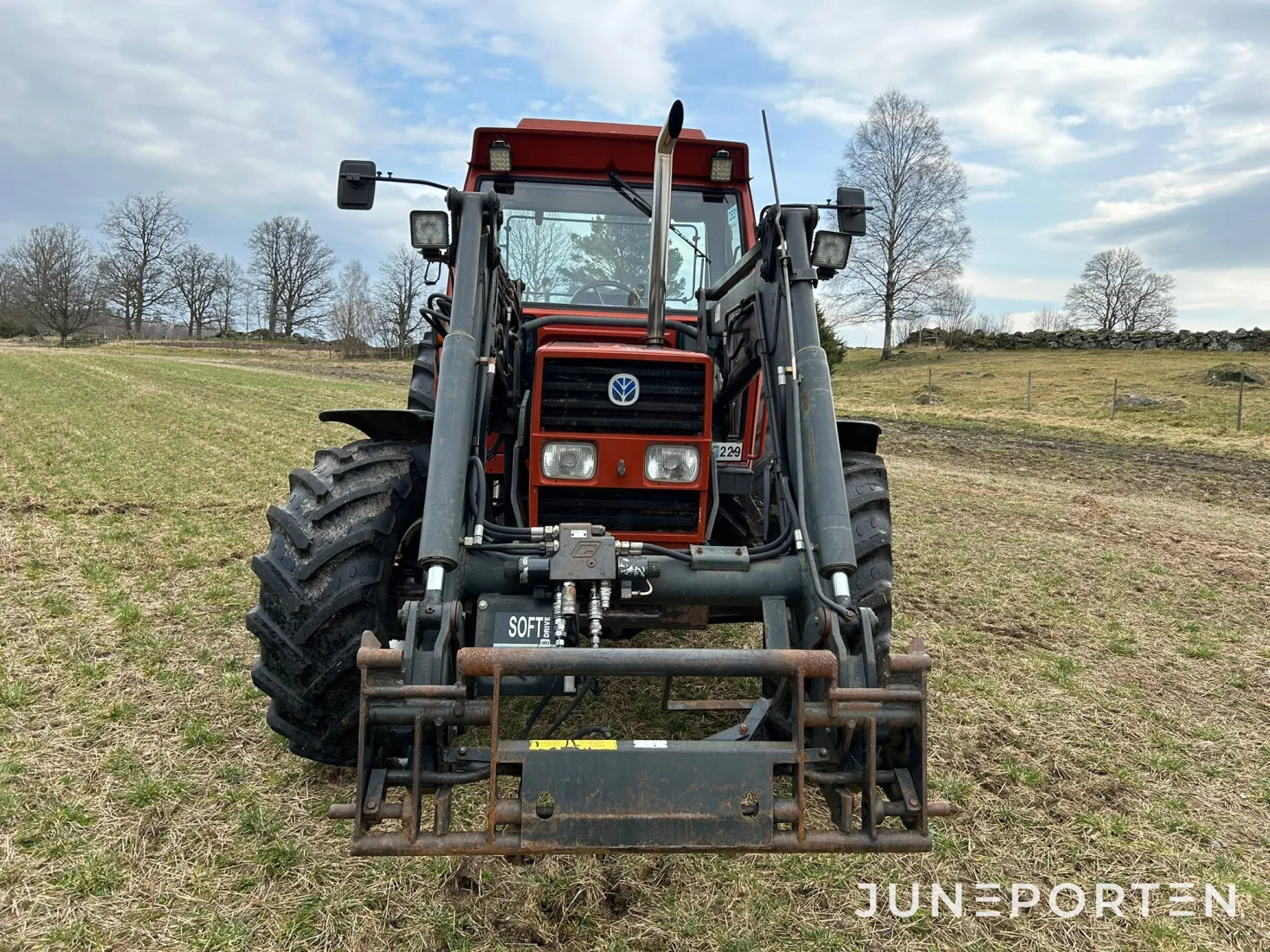 New Holland 110-90 med lastare