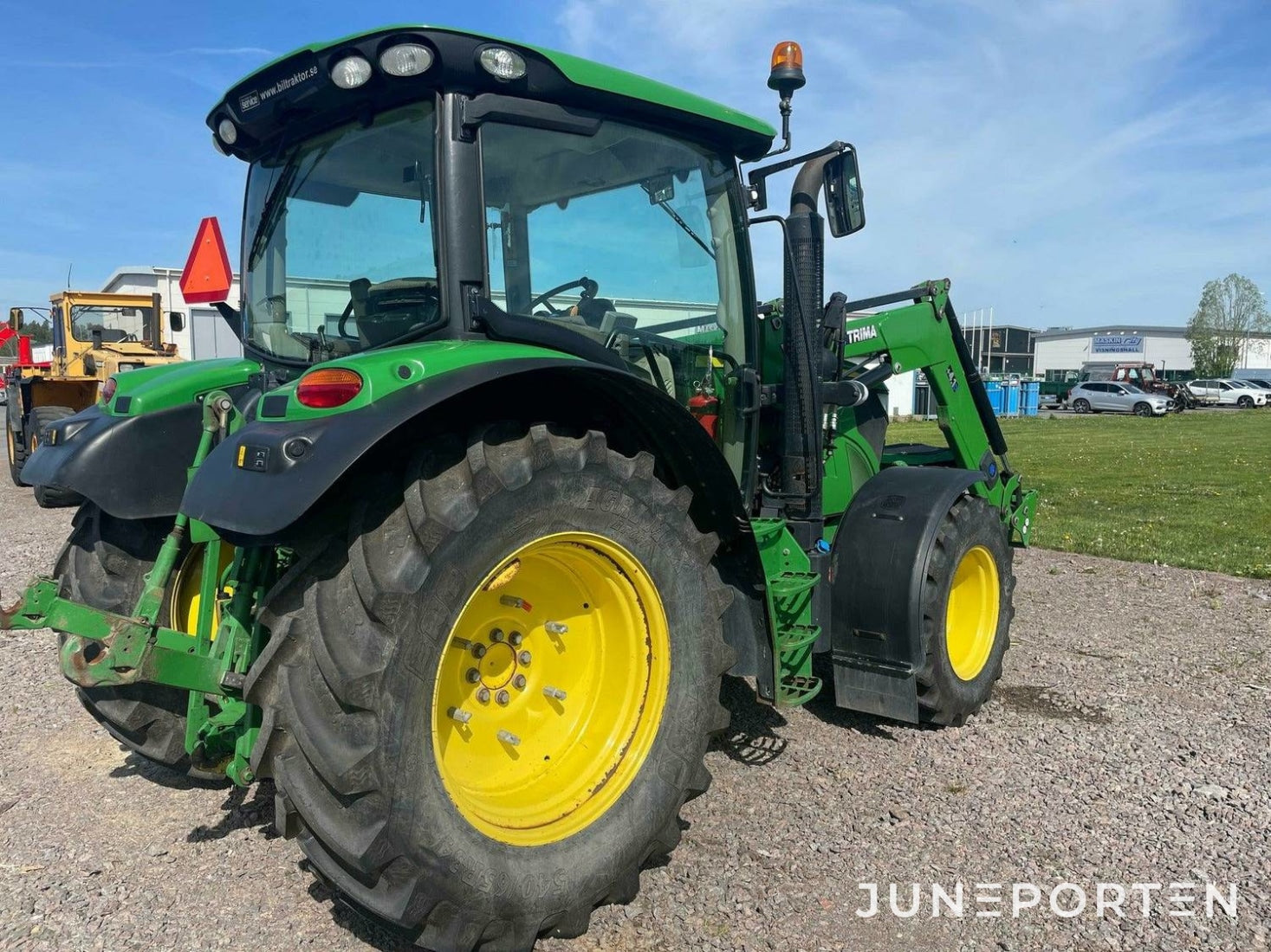 John Deere 6115R med lastare